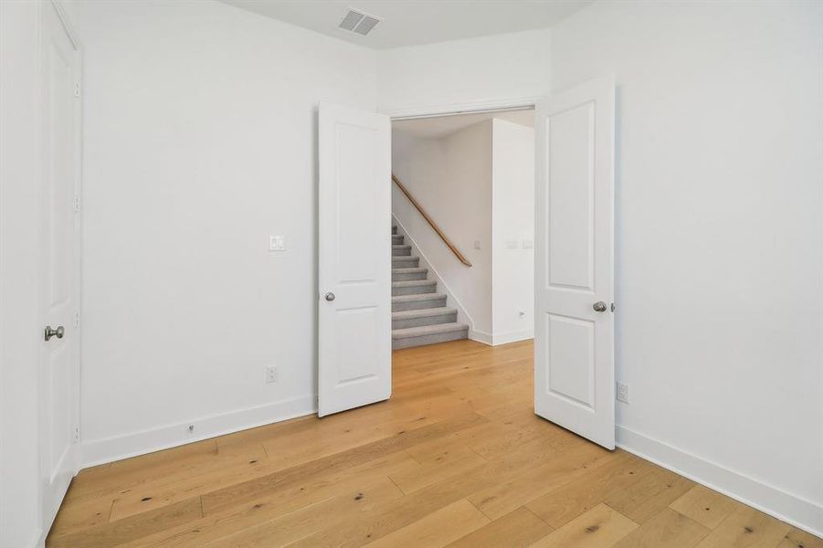 Spare room featuring light wood-type flooring