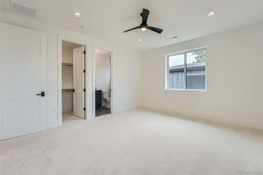 Second upper level bedroom with en-suite bath.