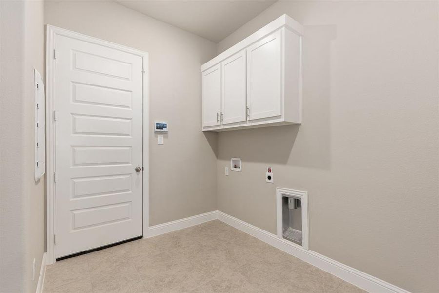 Laundry room featuring washer hookup, cabinets, and hookup for an electric dryer