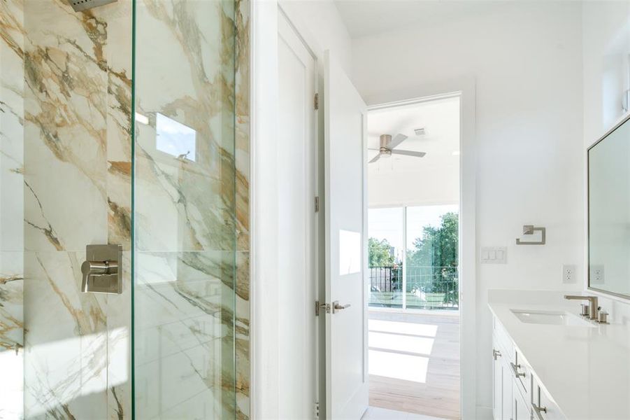 Bathroom featuring vanity, hardwood / wood-style floors, ceiling fan, and an enclosed shower