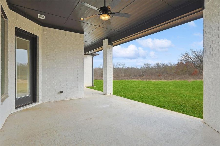 View of patio featuring ceiling fan