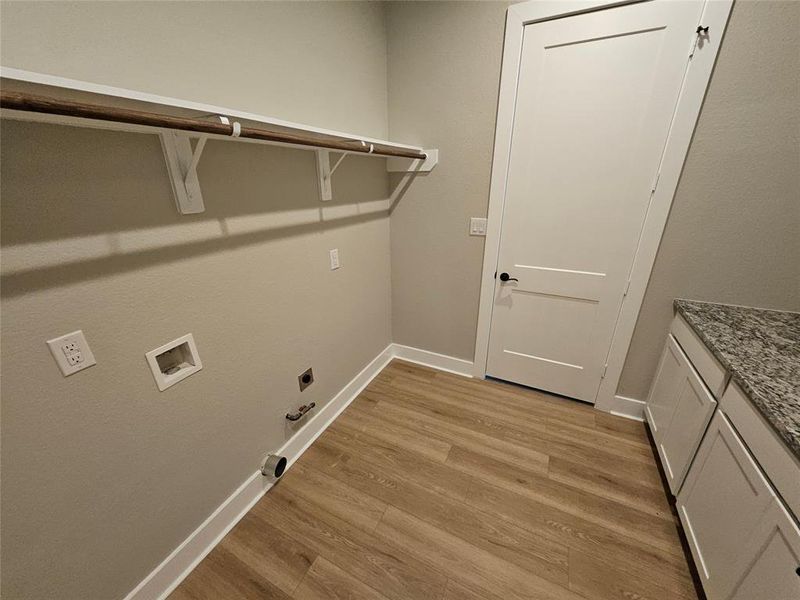 Laundry room accessible from the mud room AND the primary closet!!