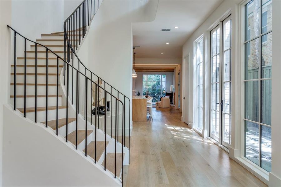 Stairs featuring wood-type flooring