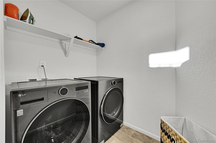 The laundry room completes the upper level and offers laminate flooring, built-in shelving and plenty of space. The washer and dryer come with the home, how convenient!