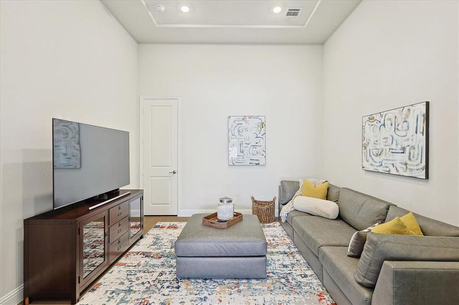 Living room with hardwood / wood-style flooring