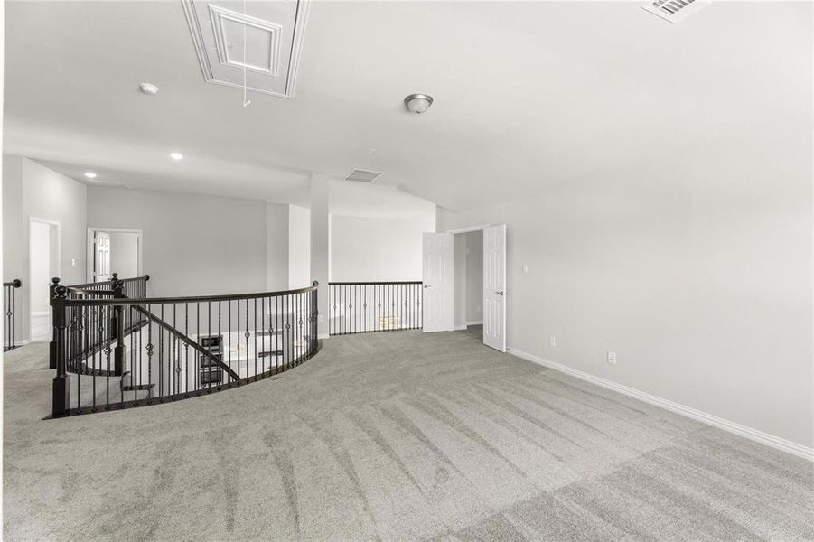 Unfurnished room with light colored carpet