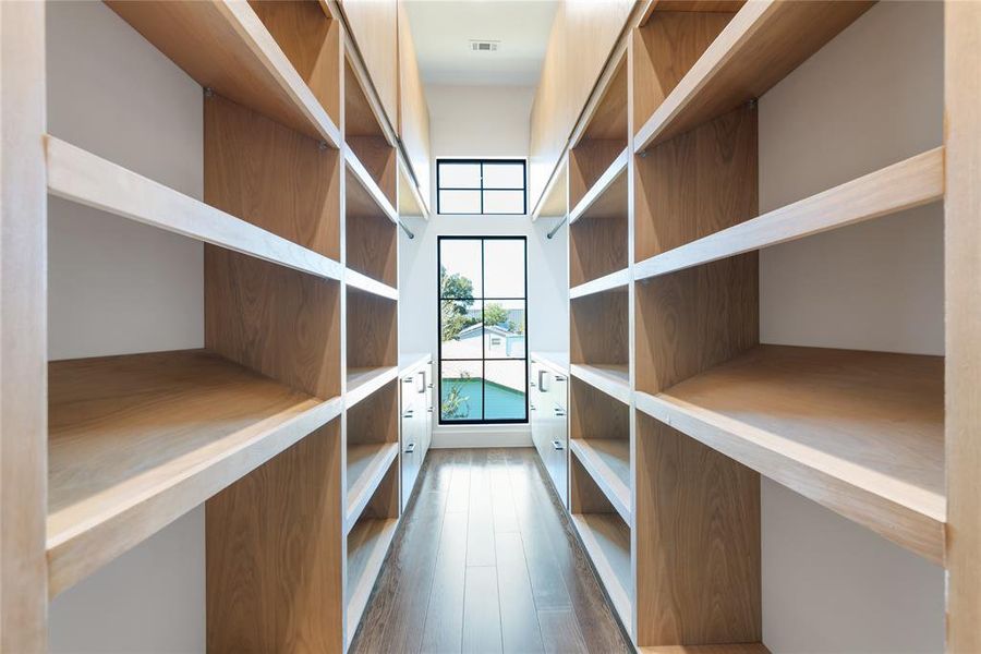 Primary closet made to impress, built in storage and organization galore!