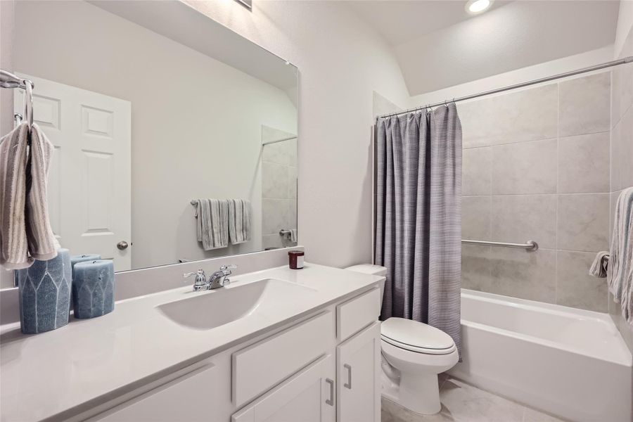 The 2nd bathroom has plenty of space to spread out all of your toiletries and get ready with ease.  The shower/tub has built-in bars for family members who need a little help getting in and out of the tub.