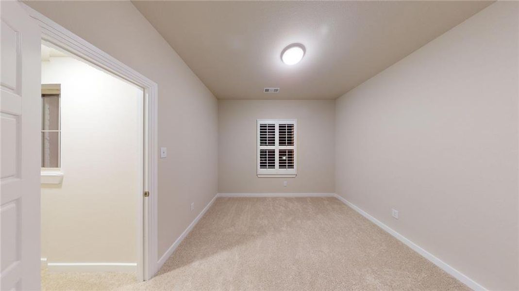 View of carpeted spare room