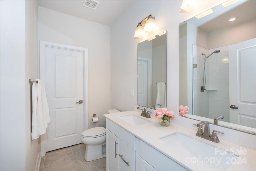 Dual vanity in primary bathroom.