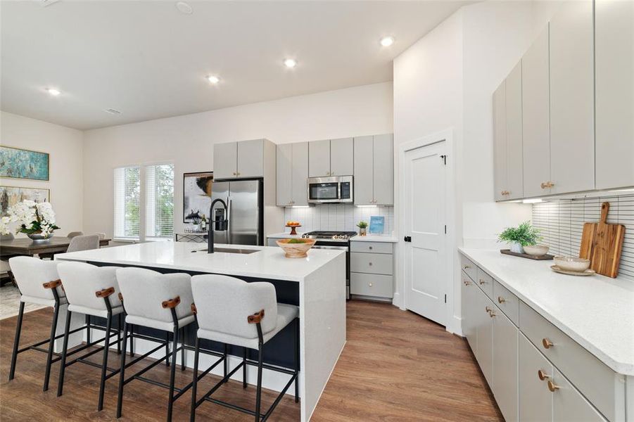 Gourmet Kitchen Will Be Any Home Chef's Dream. It Features Stunning Quartz Countertops, All Matching Appliances, Tons Of Cabinet Space And An Oversized Walk In Pantry That Fits Absolutely Everything