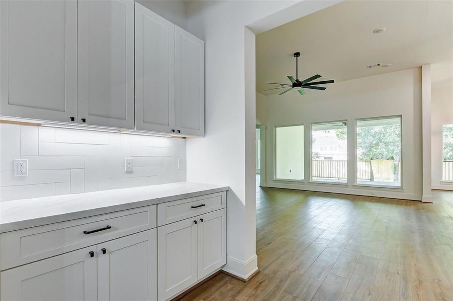 The butler's pantry features coordinating aesthetics and additional storage space!