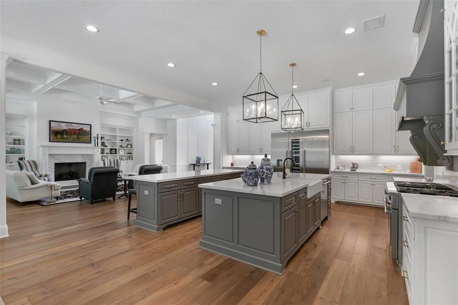 Open to both family and dining rooms, the kitchen is a chefs delight with top of the line stainless steel appliances, lots of prep and storage space. The breakfast bar is the perfect spot to catch a quick bite.