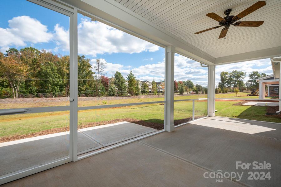 You won't believe the size of this screened lanai (w/ceiling fan) at rear of home that has additional patio space beyond & overlooks private rear yard with berm. Gas stub out for grill or outdoor firepit.