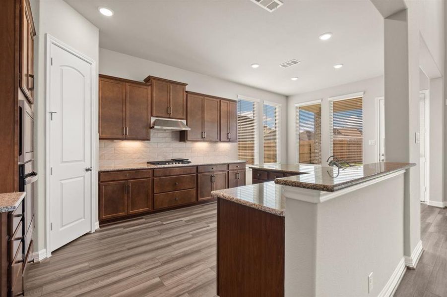 This kitchen is not only a functional space but also has ample storage. Whether you're a seasoned chef or just love to gather and enjoy good food, this kitchen is a dream come true.