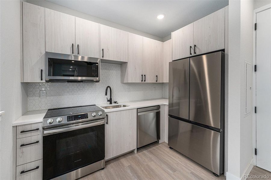 Cute 1 Bedroom kitchen.  Samsung appliances