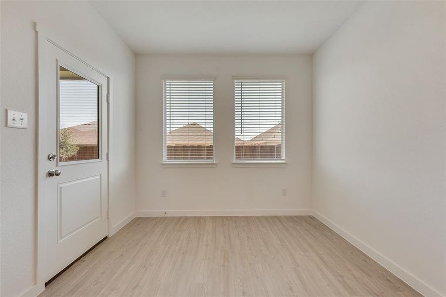 Unfurnished room with light wood-type flooring