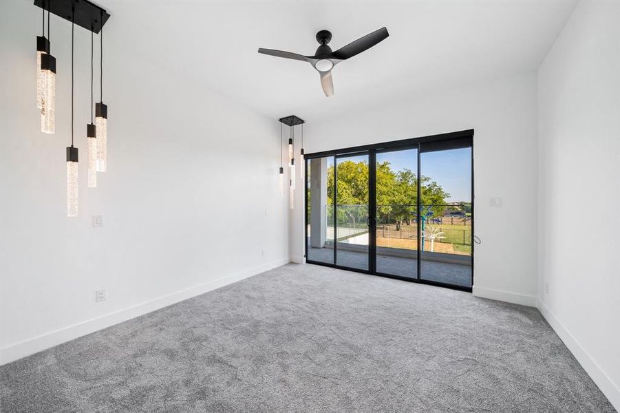 Unfurnished living room with carpet flooring and ceiling fan