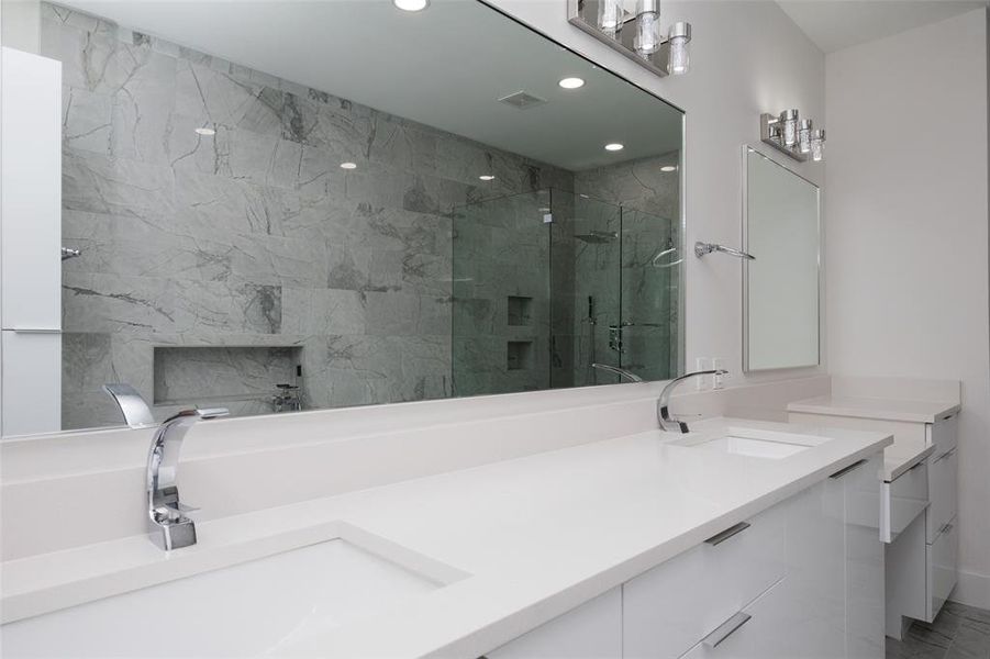 Bathroom with walk in shower and dual bowl vanity