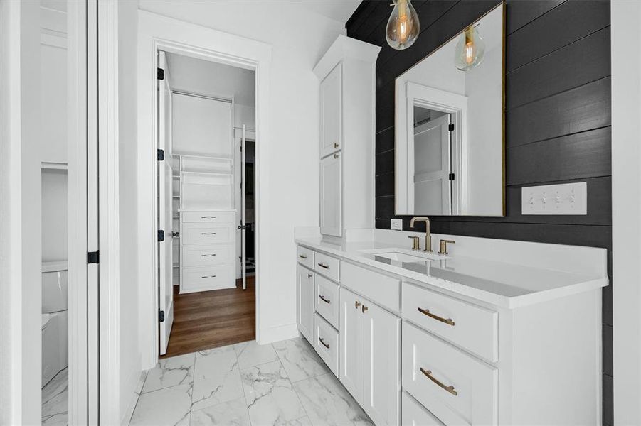 Bathroom with tile patterned floors and vanity