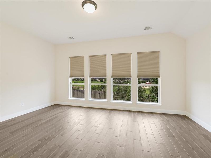 You'll love the large primary bedroom with upgraded tile floors and great natural light.