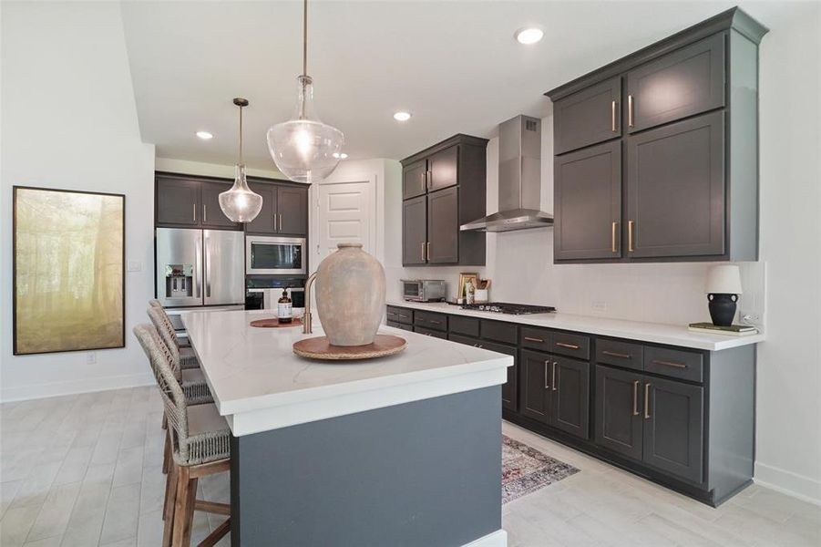 Modern kitchen, quarts counters, gold hardware, soft close doors and drawwers.