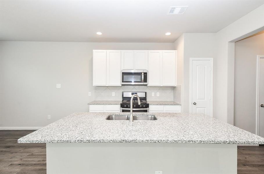 A modern kitchen with a large island