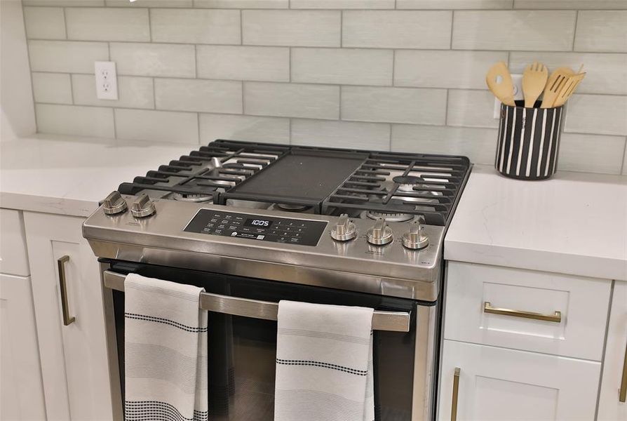 A gas cooktop and stunning hood awaits delivery.