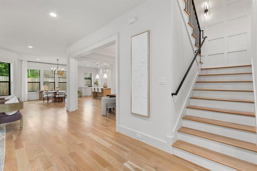 Foyer opens up to Family, Formal Dining, Kitchen/Breakfast & wide staircase.