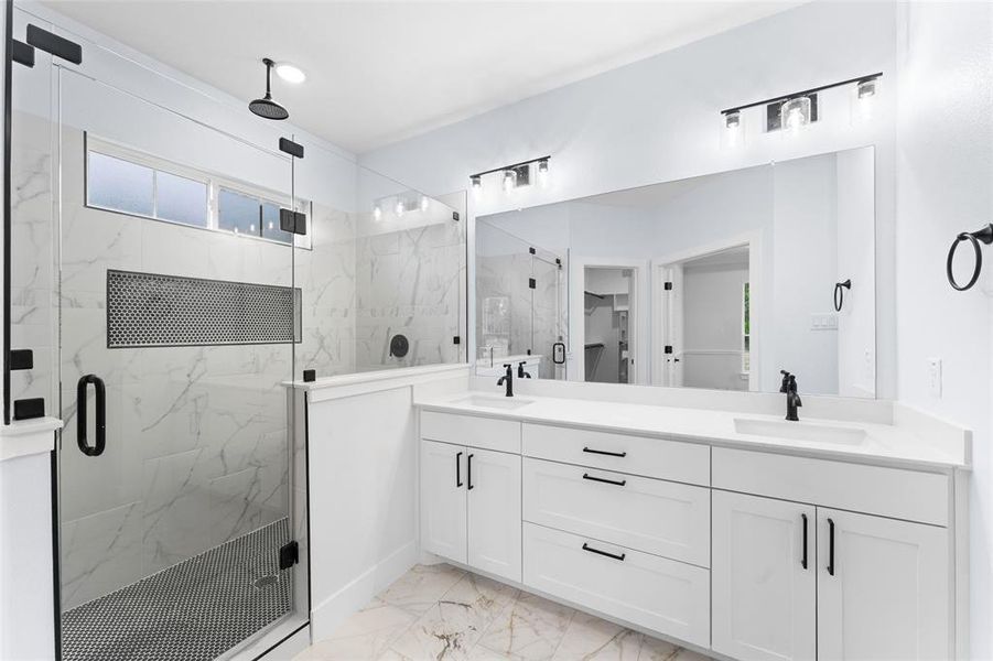 Bathroom featuring vanity and walk in shower