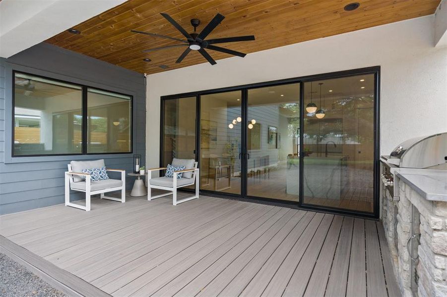 The backyard beckons with its expansive covered back deck, an ideal spot for enjoying lazy Sunday brunches or evening barbecues with friends and family