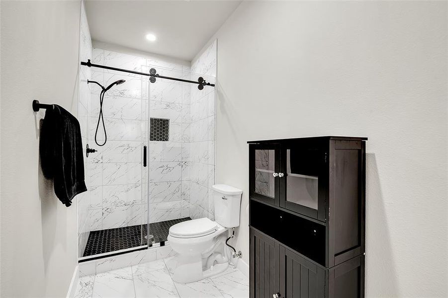 Bathroom with walk in shower and toilet