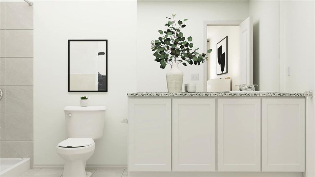 Bathroom featuring tile floors, vanity, and toilet