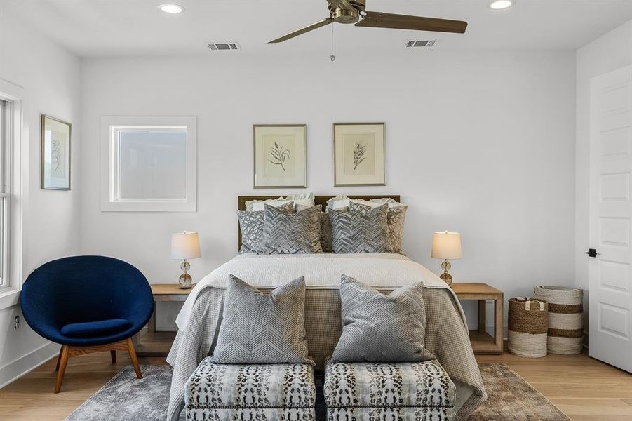 Example of large primary bedroom with lots of natural light