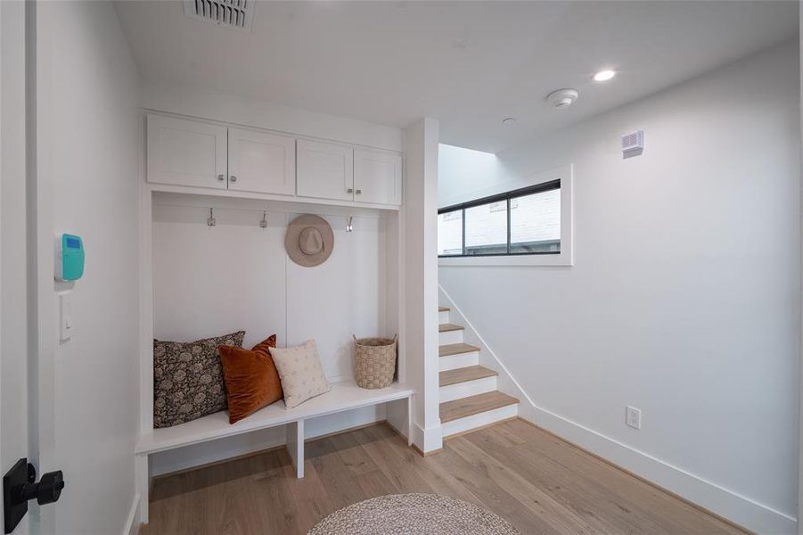 Mudroom with light wood-type flooring