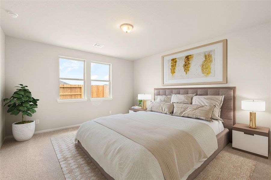 The primary bedroom is generously sized, creating a tranquil and spacious retreat that offers ample room for relaxation. Featuring plush carpet, high ceilings, fresh paint, and large windows that lets in natural lighting throughout the day.