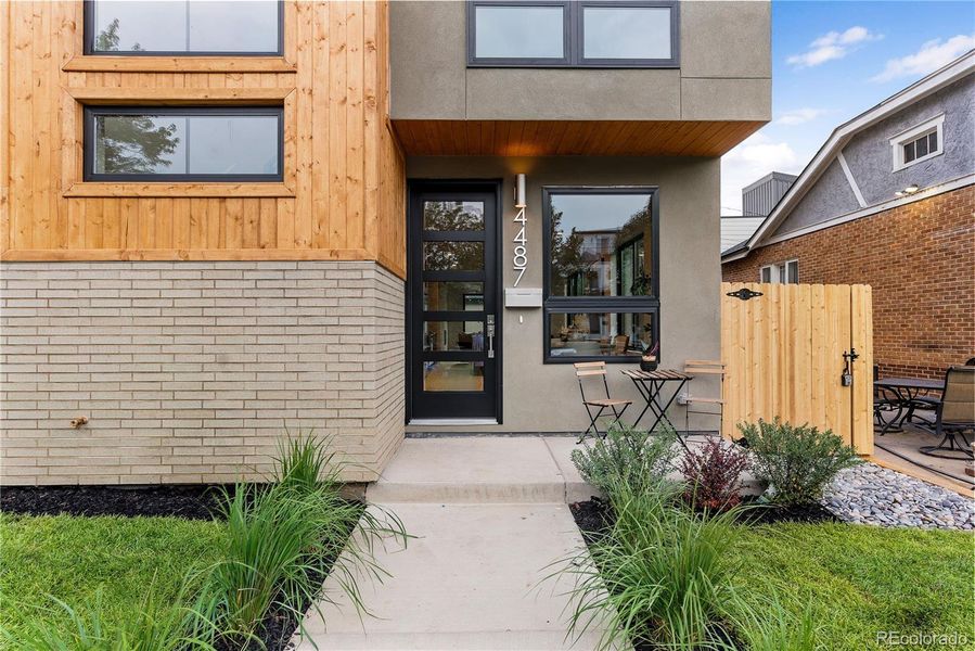 Charming private front porch with overhang cover as your guests arrive.