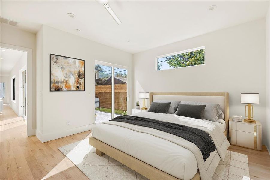 Bedroom with access to outside and light hardwood / wood-style floors