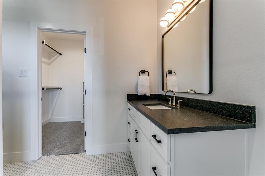 Bathroom with vanity and tile floors