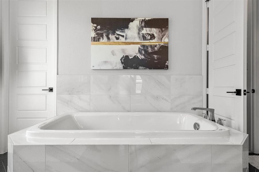 Bathroom with tiled tub