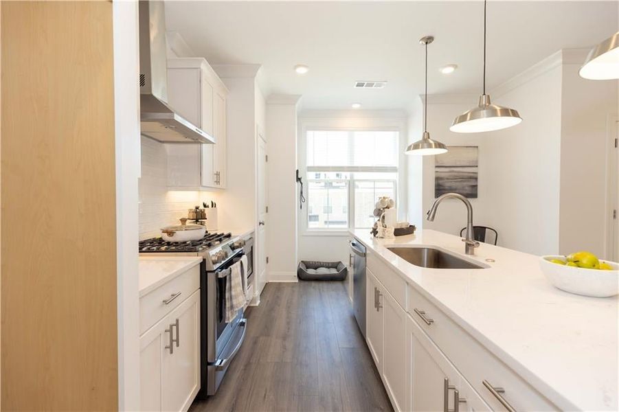 Natural light fills the kitchen. *Photos of model home from a different community. Used for illustrative purposes only.*