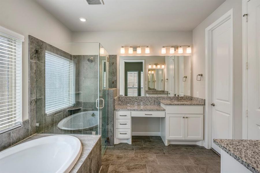 Upgraded frameless shower and dual vanities