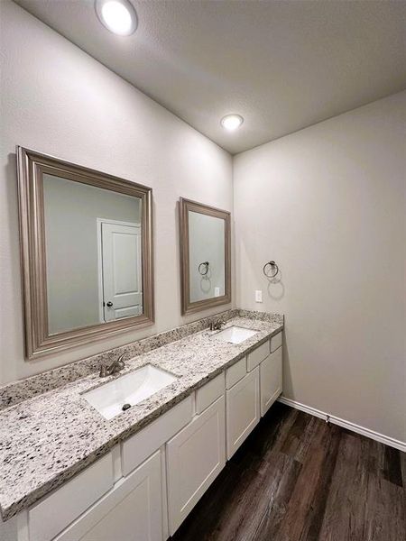Double sinks+ granite counters &  framed mirrors