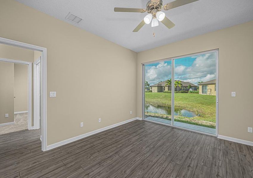 The family room has a sliding glass door that leads out into the backyard