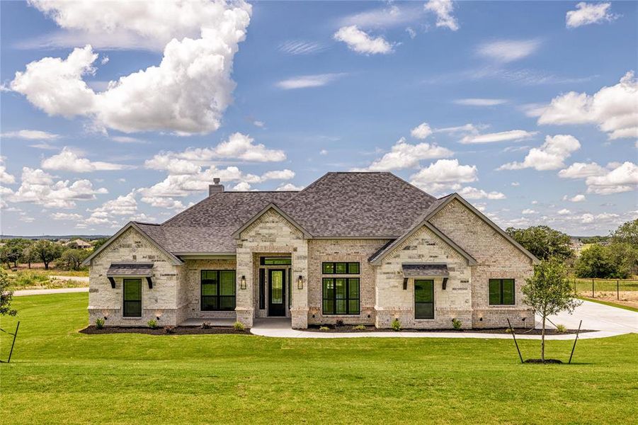 View of front of house featuring a front lawn