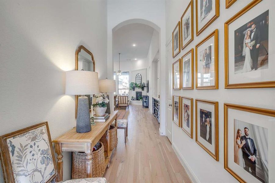 Corridor with light hardwood / wood-style flooring