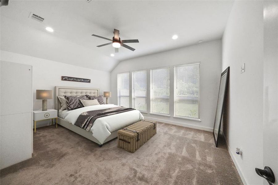 Spacious Primary bedroom with views of the nature preserve. The owners upgraded the fans in this room and the living room.
