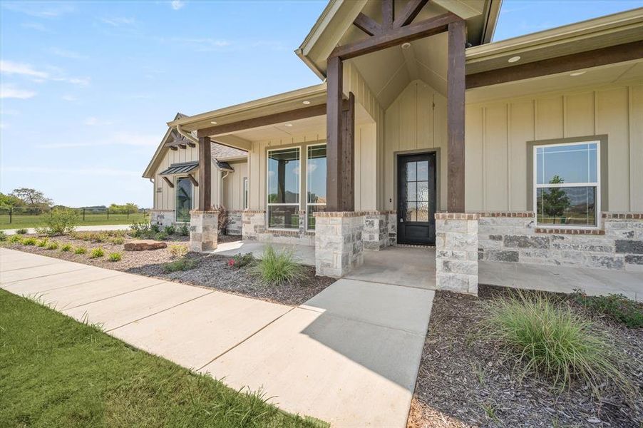 Doorway to property featuring a porch