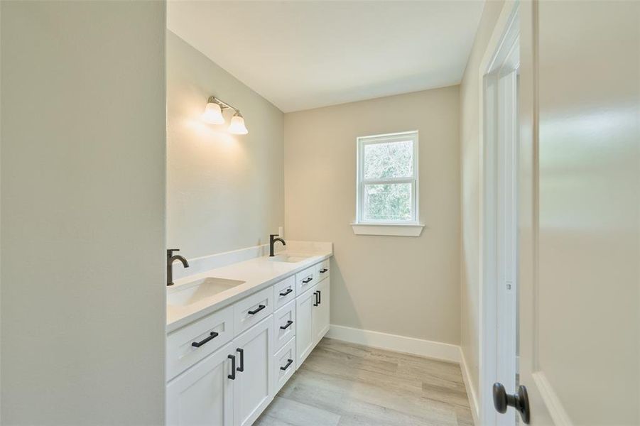 upstairs bath features dual sinks.  Mirrors coming soon