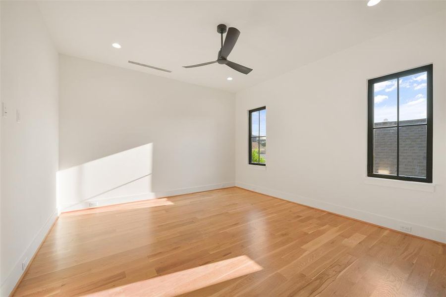 Bedroom three highlights the hardwood floors through out.